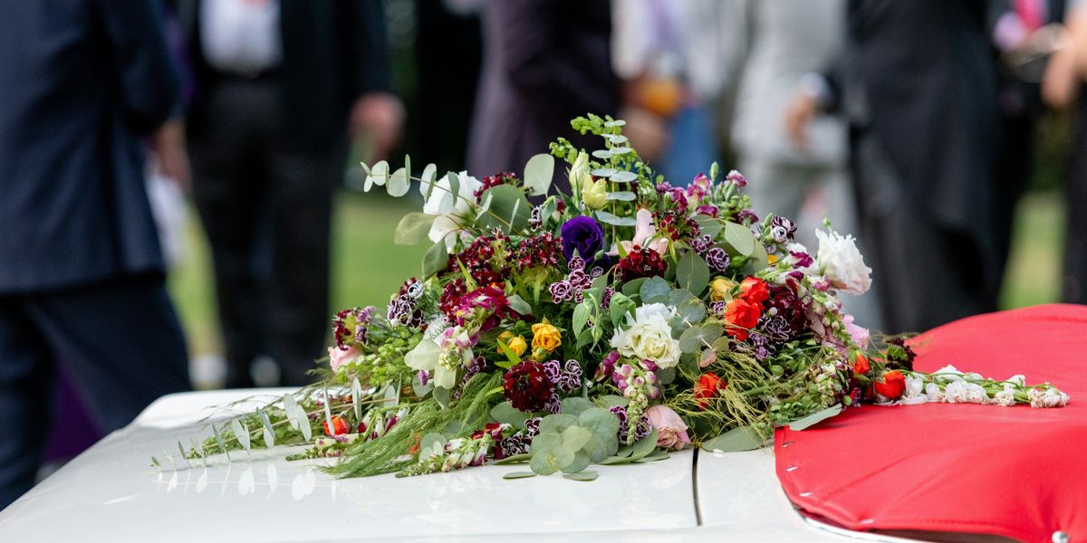 funeral flowers on trunk of car