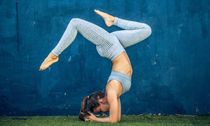 Woman performing extreme yoga on a busy highway on Craiyon