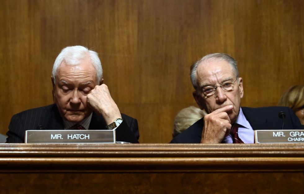 People Can't Get Enough of This Photo of Two Republican Senators and a Senate Staffer Reacting to Jeff Flake at the Kavanaugh Hearing Today